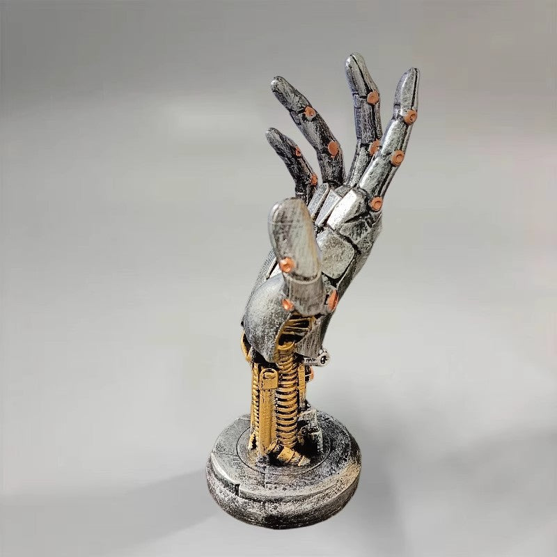 Mechanical hand sculpture on a gray background