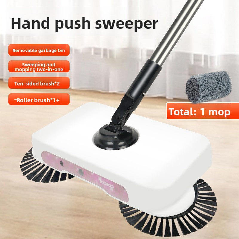 Hand push sweeper with multiple brushes on a wooden floor.
