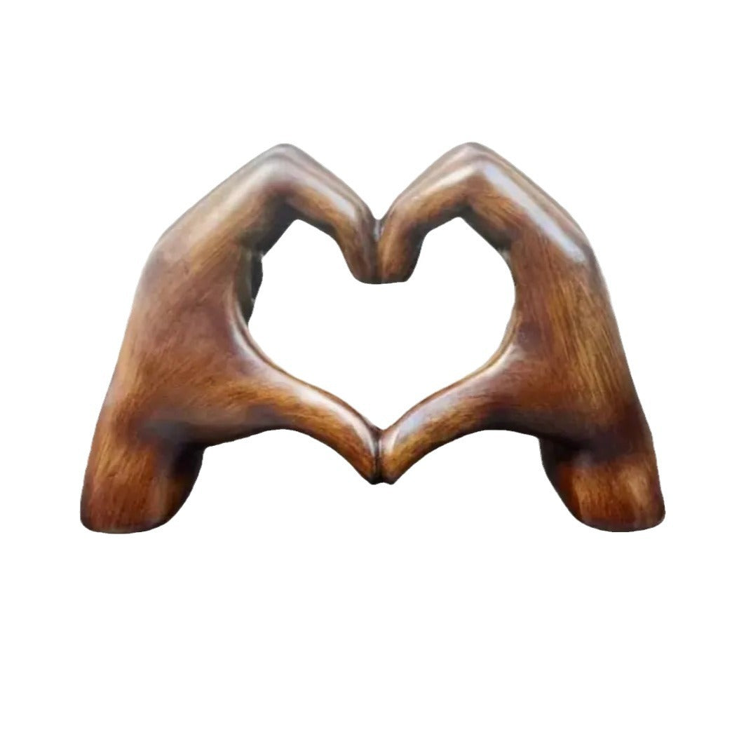 Wooden heart-shaped object on a white background