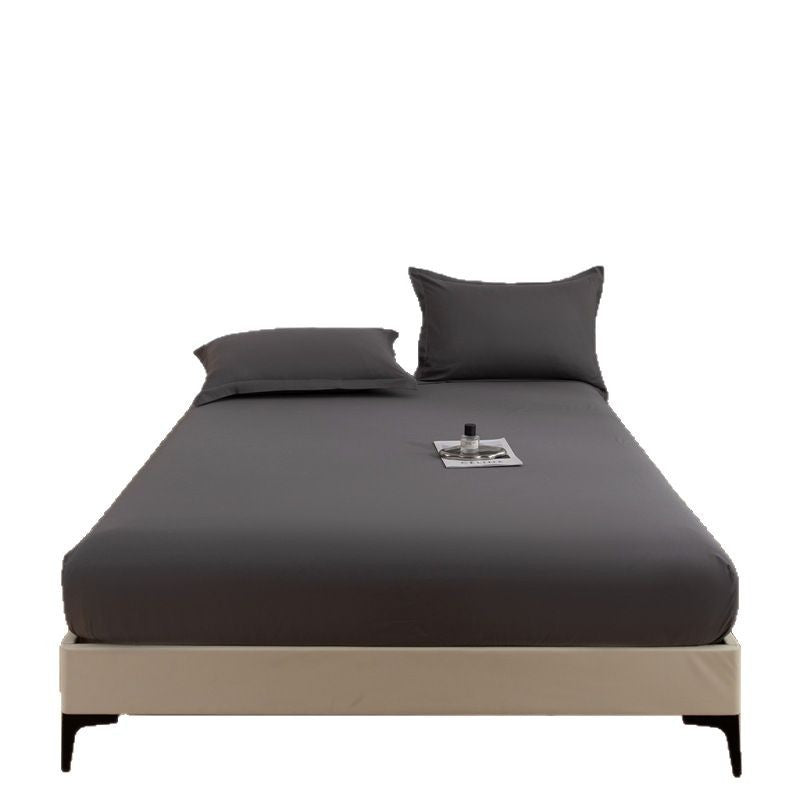 Gray bedding set on a bed with a white background