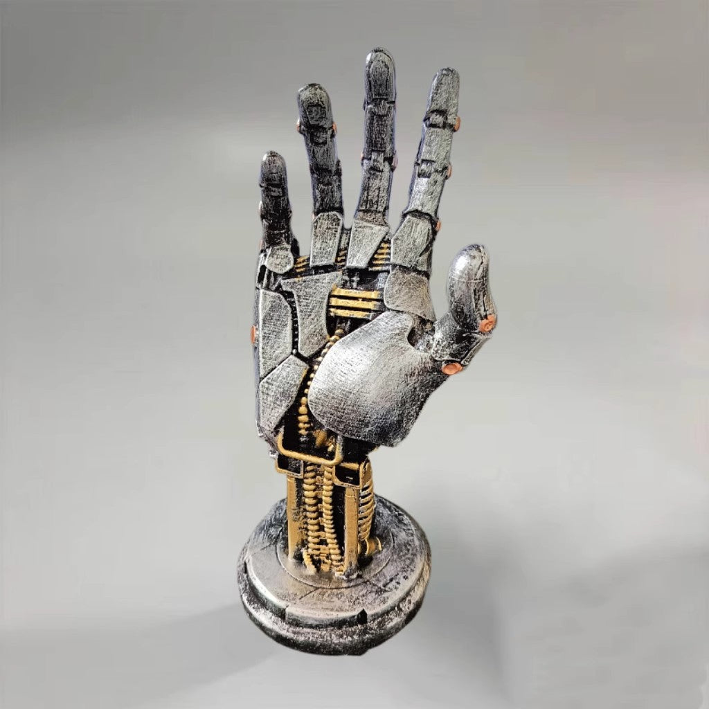 Mechanical hand sculpture on a gray background