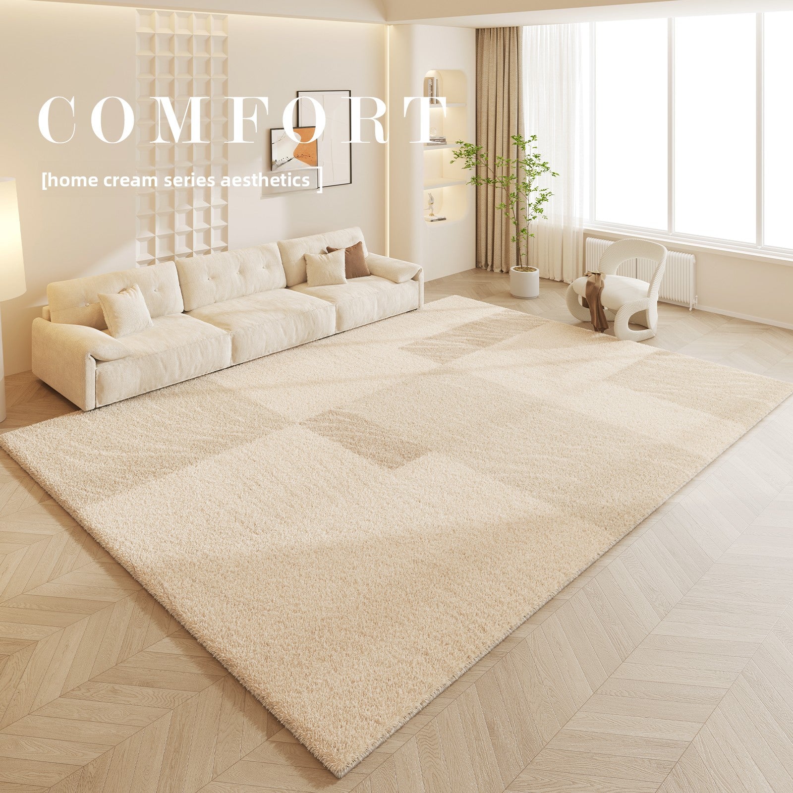 Living room with a large beige rug, white sofa, and decorative elements.