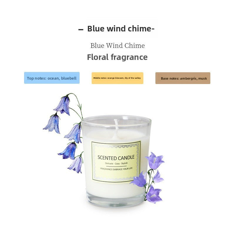 Scented candle with blue flowers and label on a white background