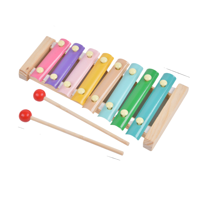 Colorful xylophone with two mallets on a white background