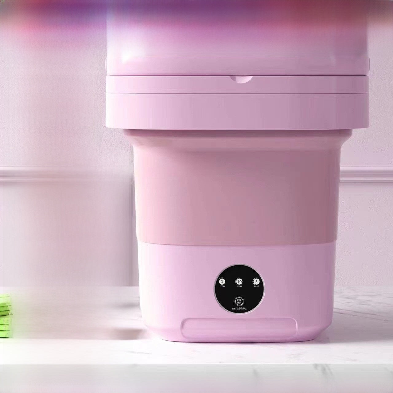 Pink appliance with control panel on a white background