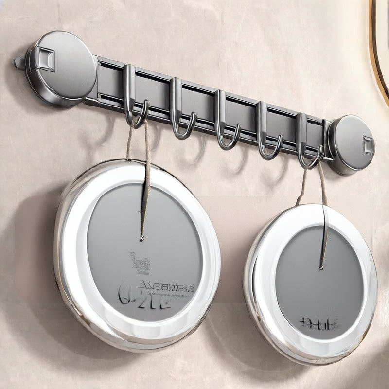Wall-mounted hook rack with circular hooks holding metal containers on a beige wall.