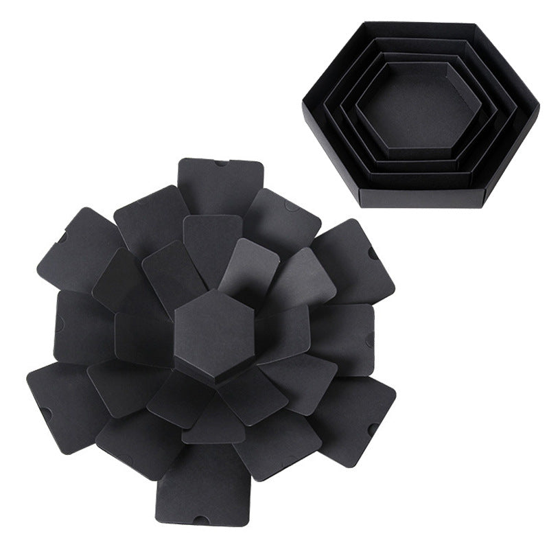 Set of black hexagonal coasters on a white background