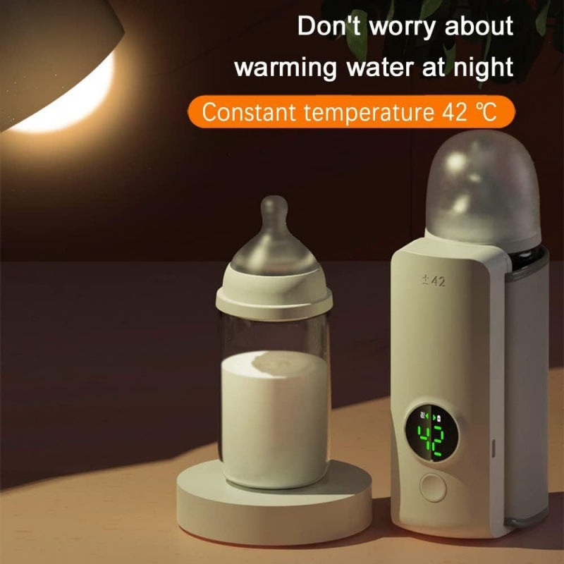 Bottle-shaped water warmer with digital display on a dark background