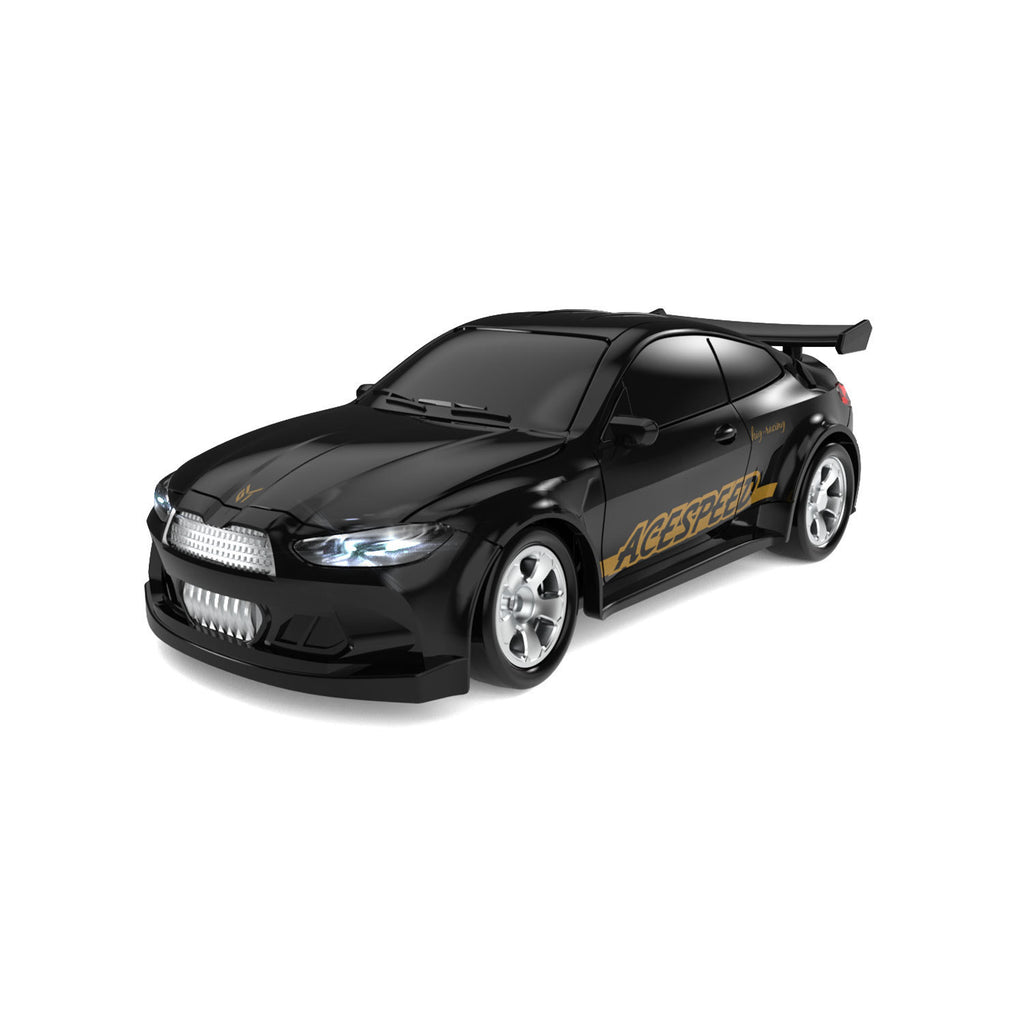 Black toy car with gold accents on a white background
