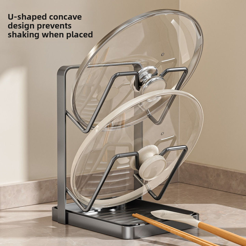 Glass lid on a stand with text explaining its design, placed on a kitchen counter.