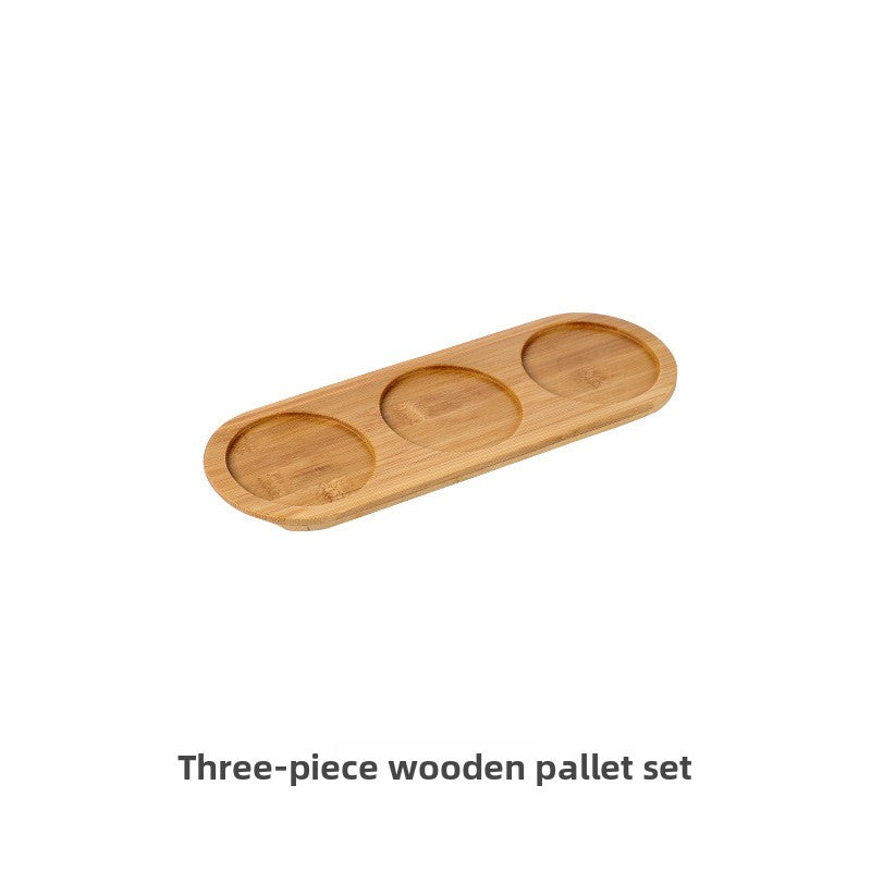 Three-piece wooden pallet set on a white background