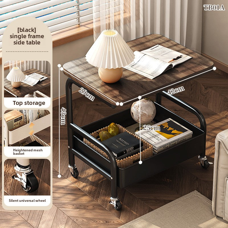 Wooden side table with black metal frame in a room setting, showing top storage, height, width, and depth measurements.