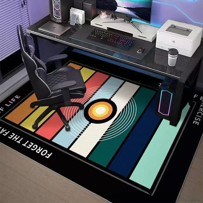 Colorful rug with geometric design in front of a computer desk