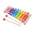 Colorful wooden xylophone with two mallets on a white background
