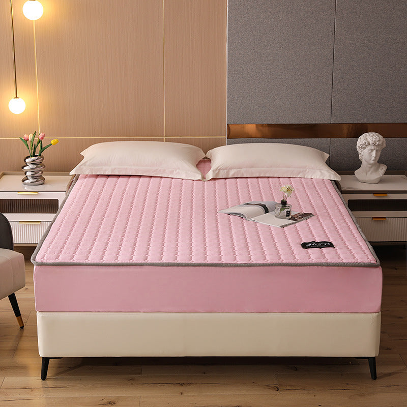 Bed with pink mattress cover in a bedroom setting