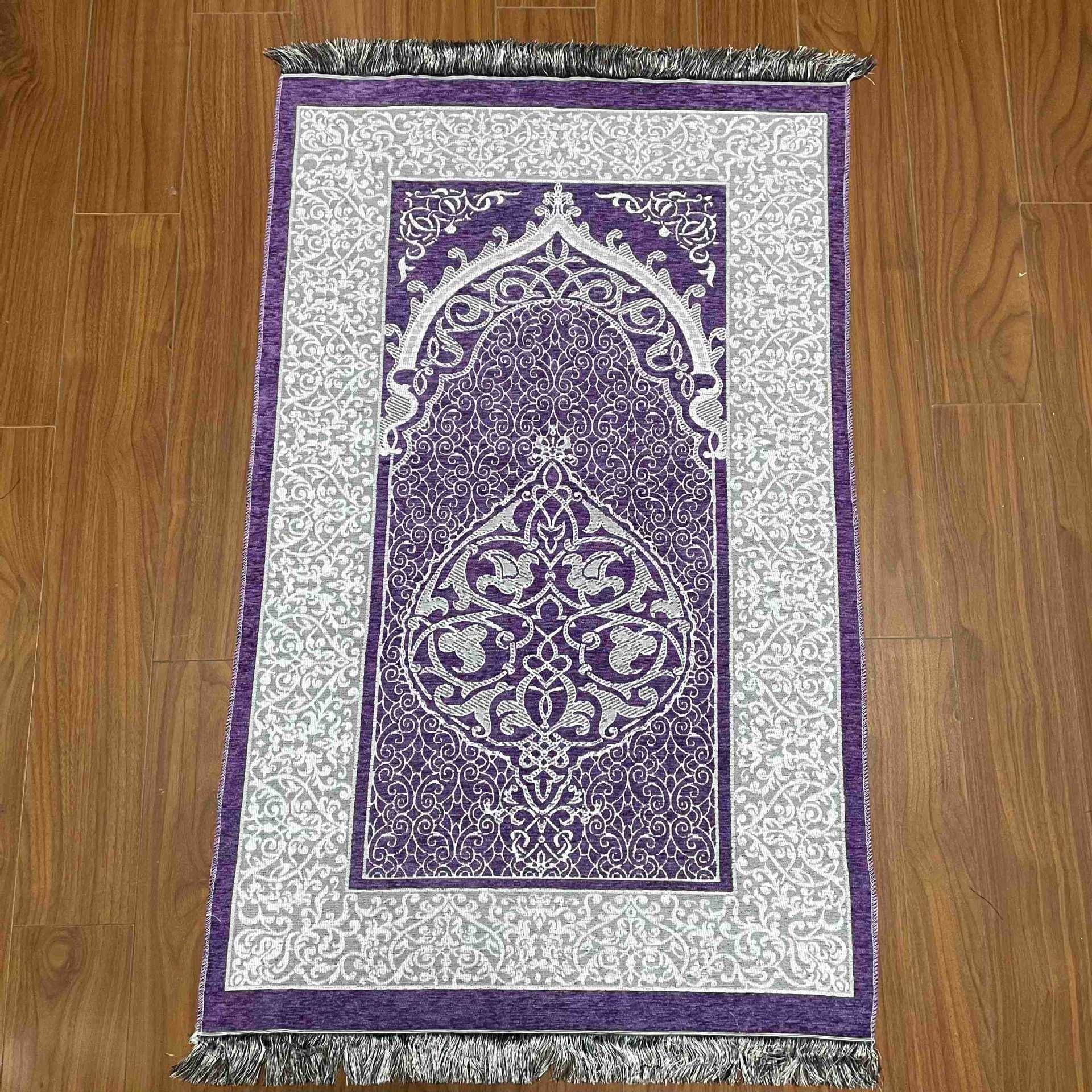 Decorative purple and white rug with intricate patterns on a wooden floor.