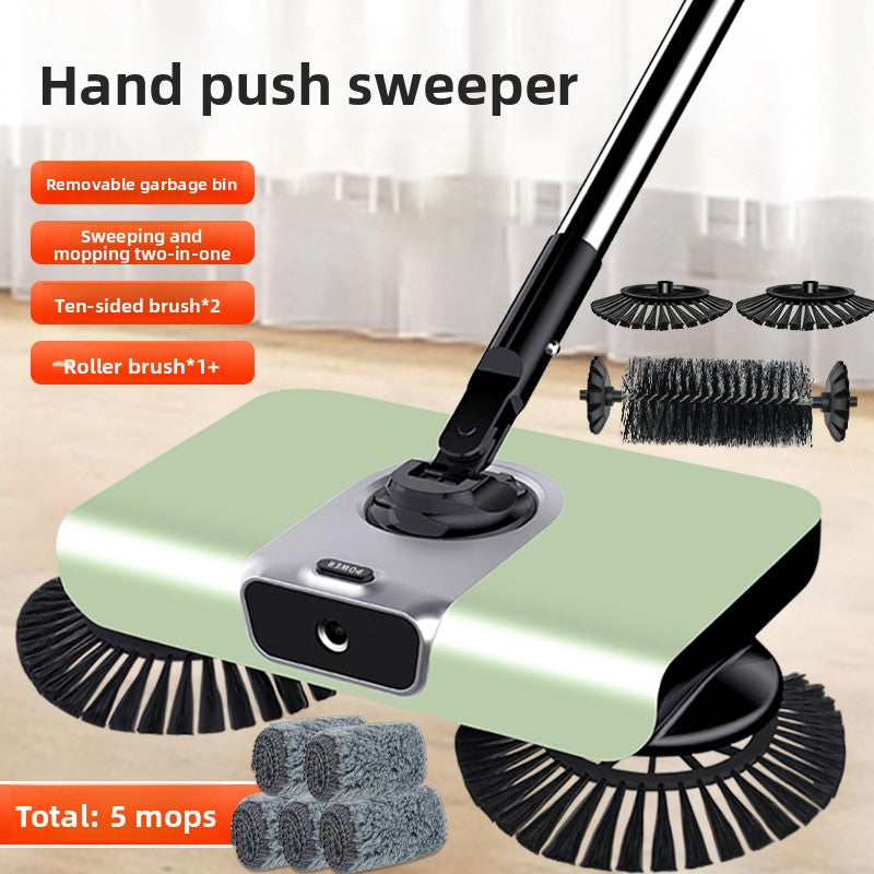 Hand push sweeper with various brush heads and a removable garbage bin on a wooden floor.