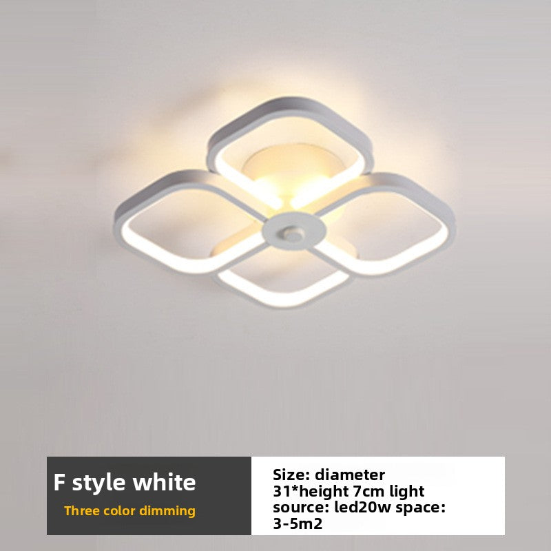 Ceiling light fixture with white square design on a gray background