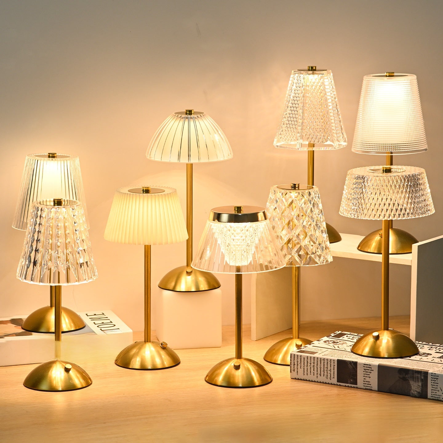 Set of decorative table lamps with various lampshades on a wooden surface.