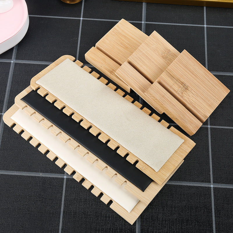 Set of wooden coasters with different shapes on a checkered surface