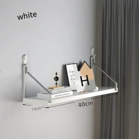 White wall shelf with dimensions on a gray wall