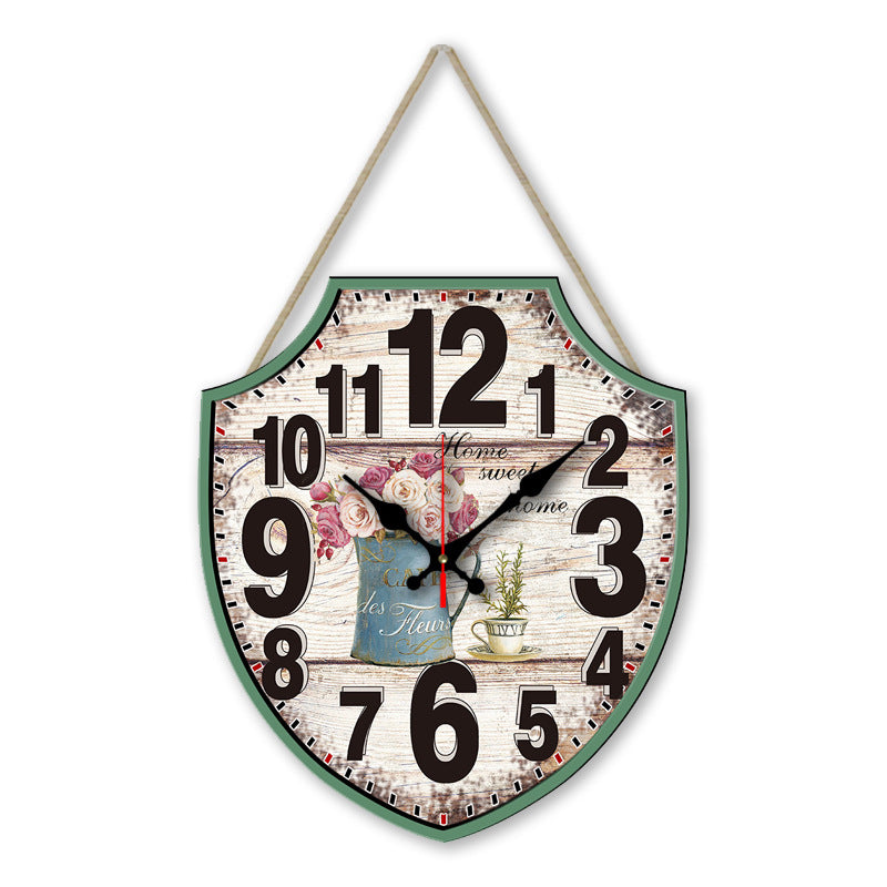 Decorative wall clock with floral design and text on a white background