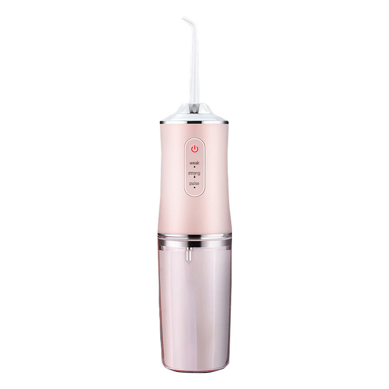 Pink dental water flosser on a white background