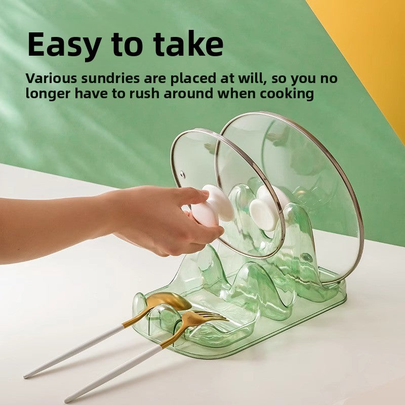 Green dish drying rack with a hand placing a lid on it, against a green and yellow background.