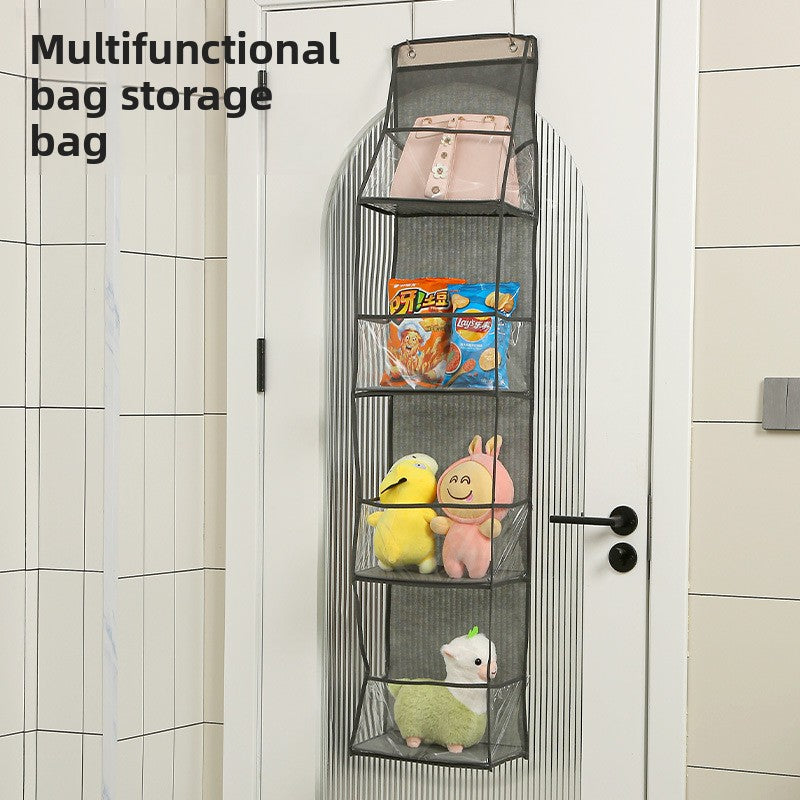 Multifunctional bag storage bag hanging on a door with toys and snacks inside.