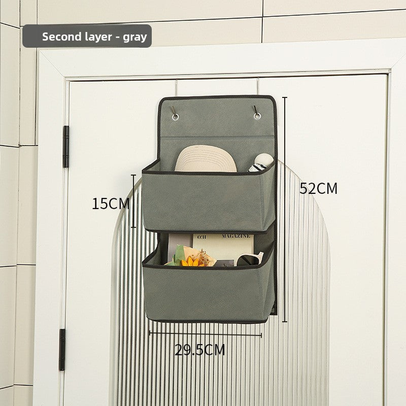 Gray wall-mounted storage organizer with dimensions labeled on a tiled wall background