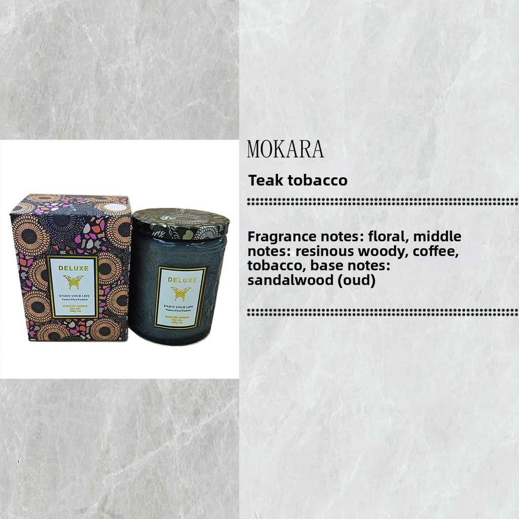 Mokara Teak Tobacco candle with packaging on a textured white background