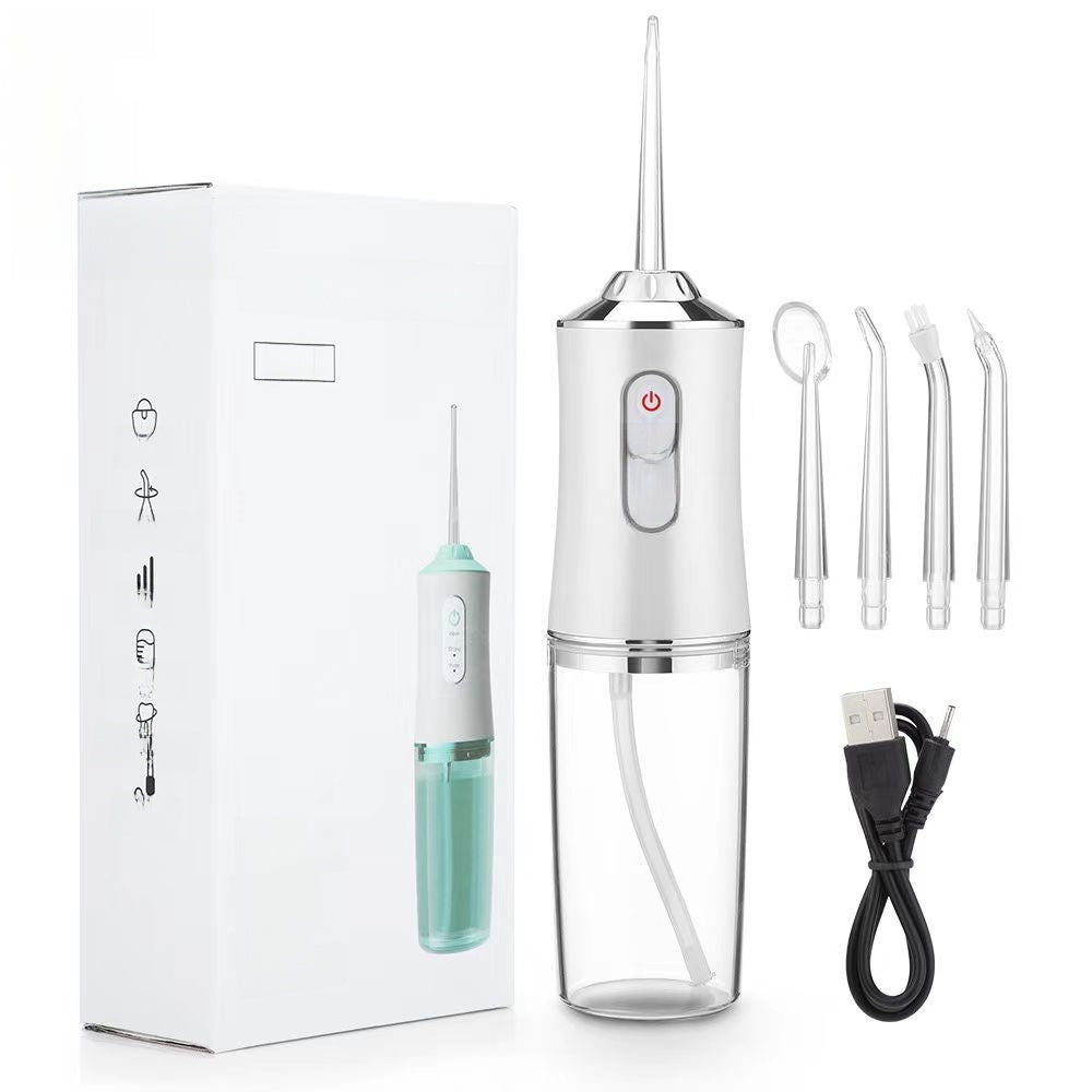 Portable water flosser with packaging, USB cable, and additional nozzles on a white background