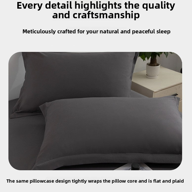 Gray pillowcases on a bed with a neutral background