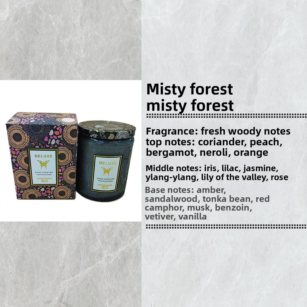 Candle with packaging and fragrance description on a textured gray background