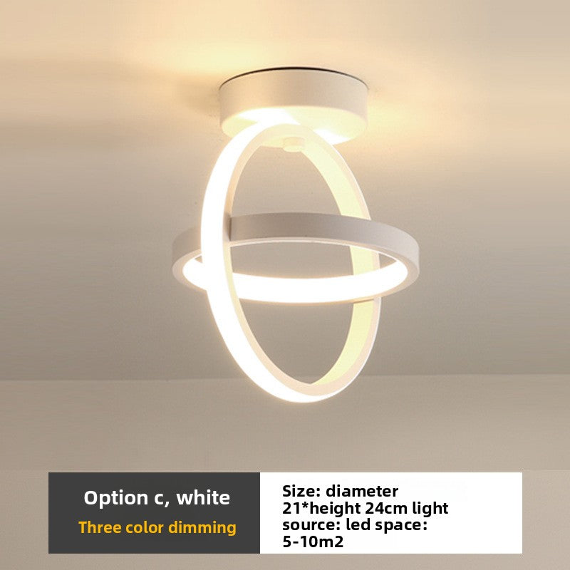 Modern ceiling light fixture with white finish on a neutral background