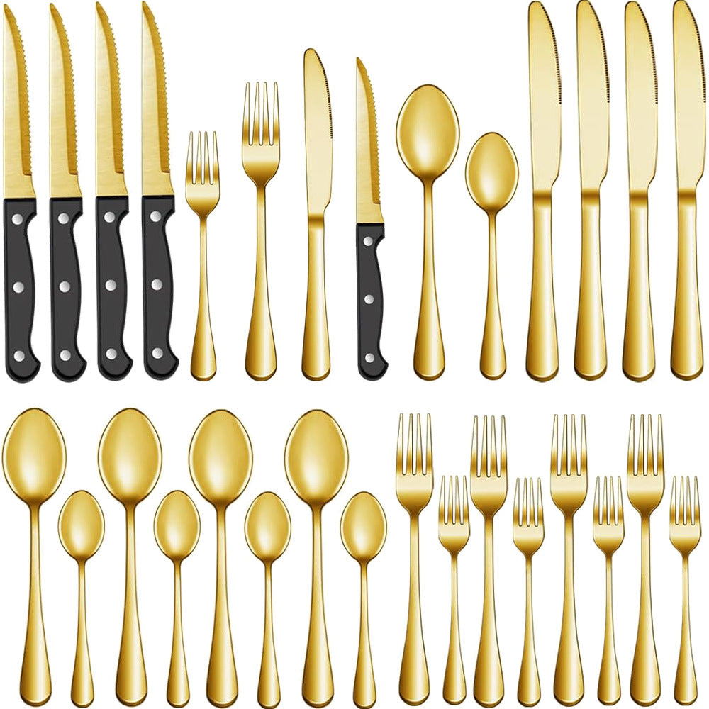 Set of gold cutlery including knives, forks, and spoons on a white background