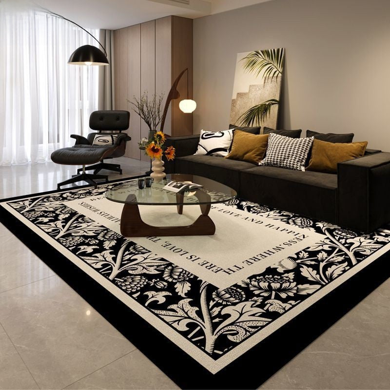 Modern living room with a decorative rug featuring text and floral patterns.