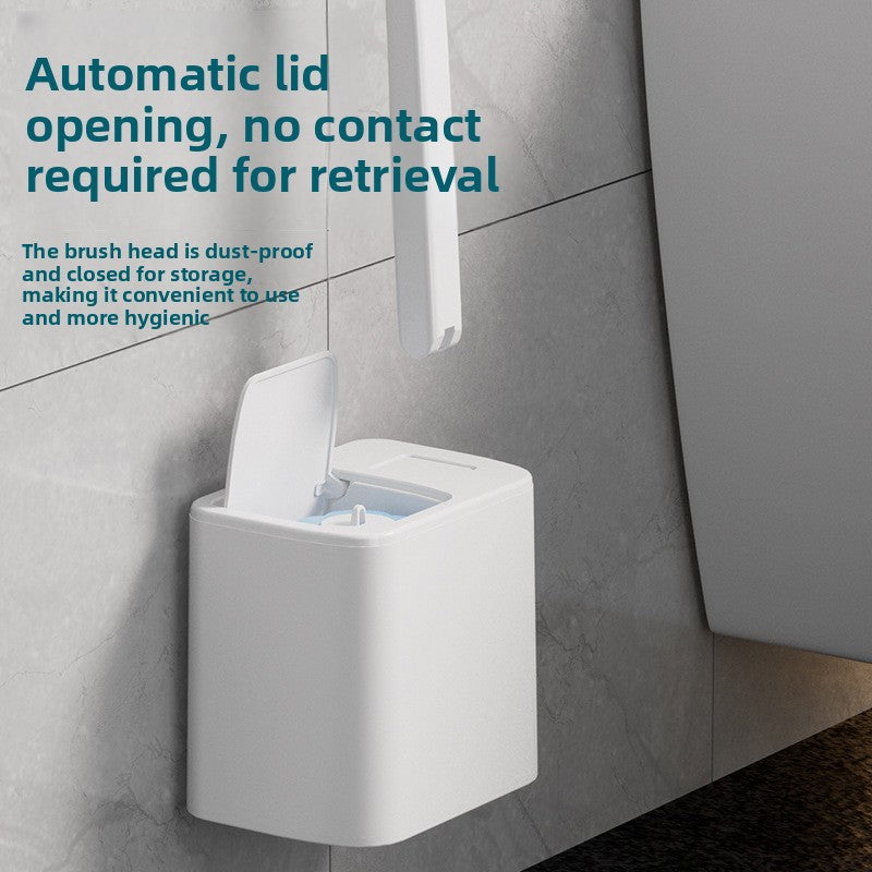 Wall-mounted white brush holder with automatic lid opening feature on a tiled wall.