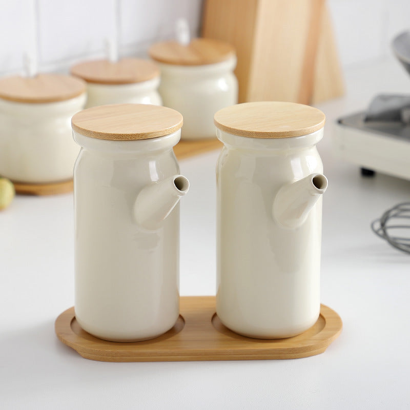 Set of ceramic jars with wooden lids on a kitchen counter