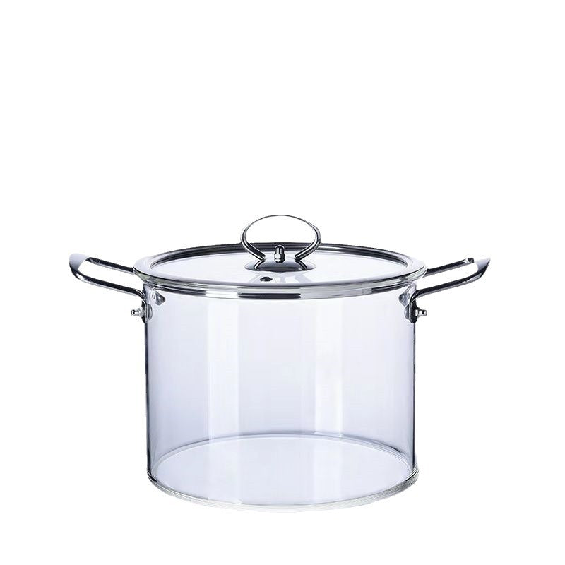 Clear glass cooking pot with metal handles and lid on a white background