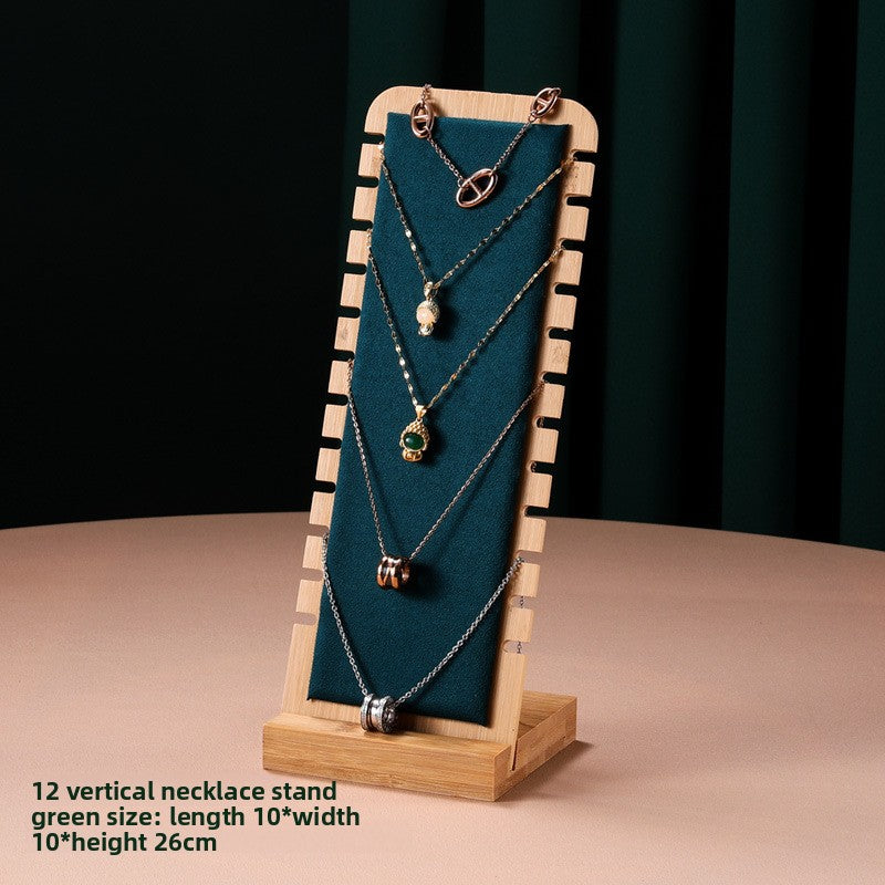 Necklace on a wooden stand with green background