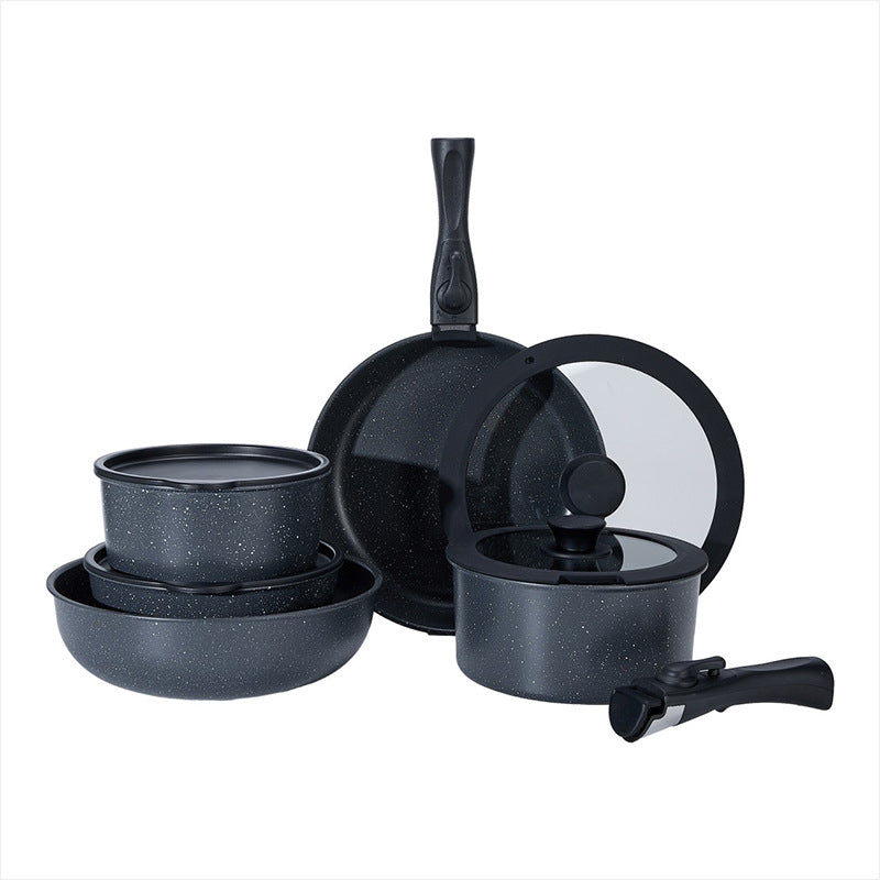 Set of black speckled cookware including pots, pans, and lids on a white background