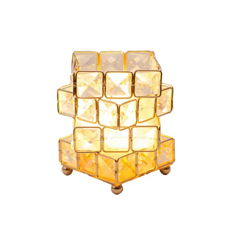 Decorative candle holder with geometric design on a white background