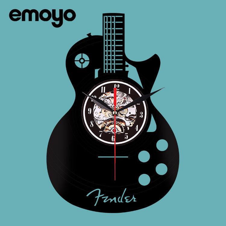 Guitar-shaped clock with mechanical design on a blue background, featuring the brand 'emoyo'.