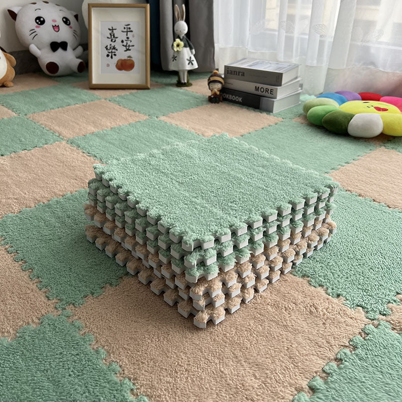 Children's room with green and beige foam play mats.