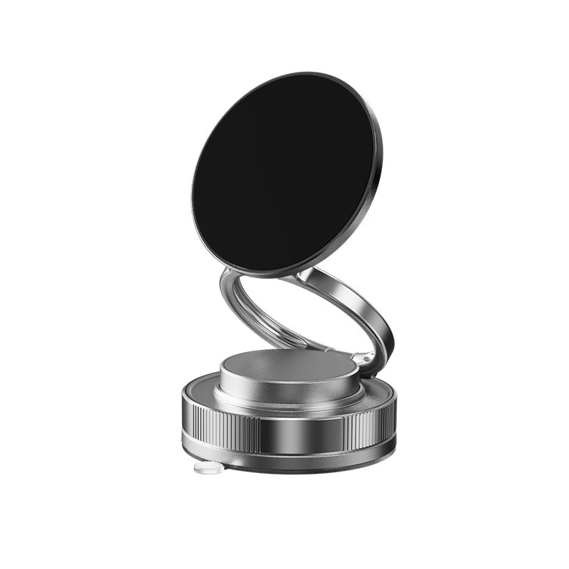 Silver phone stand with black circular pad on a white background