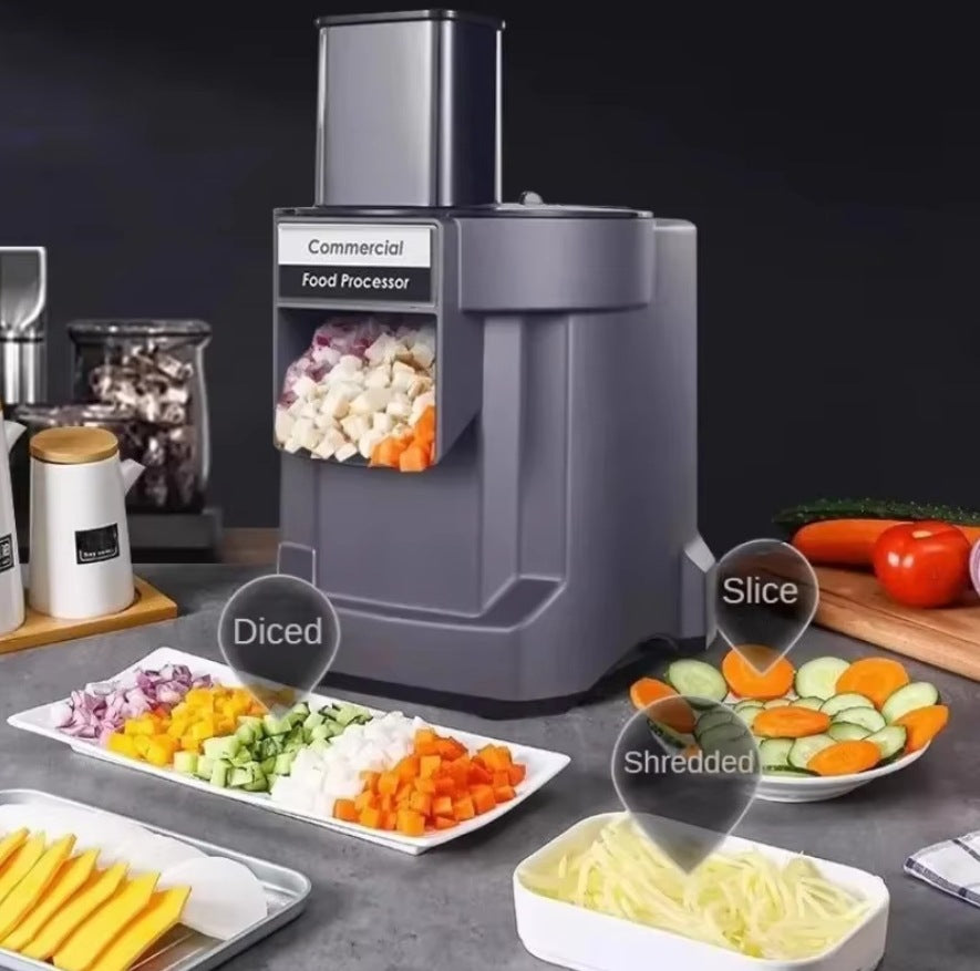Commercial food processor with sliced vegetables on a dark background