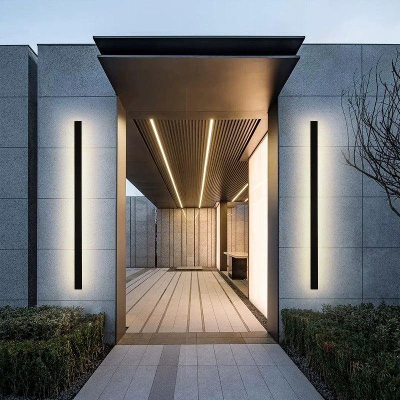 Modern architectural entrance with illuminated walls and ceiling