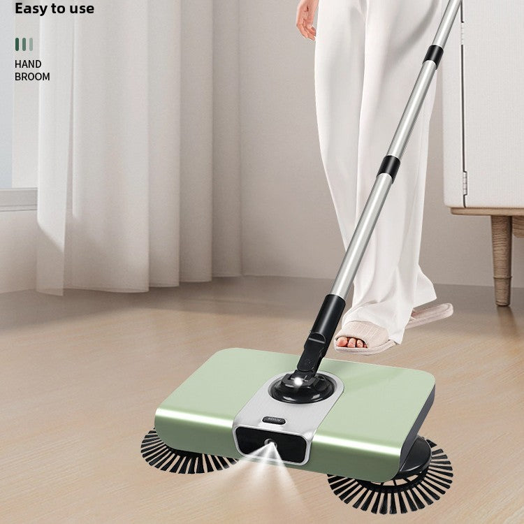 Handheld cleaning device being used on a wooden floor with a person in white pants partially visible.