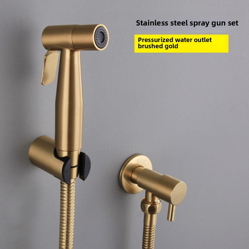 Gold stainless steel spray gun set with pressurized water outlet on a gray background